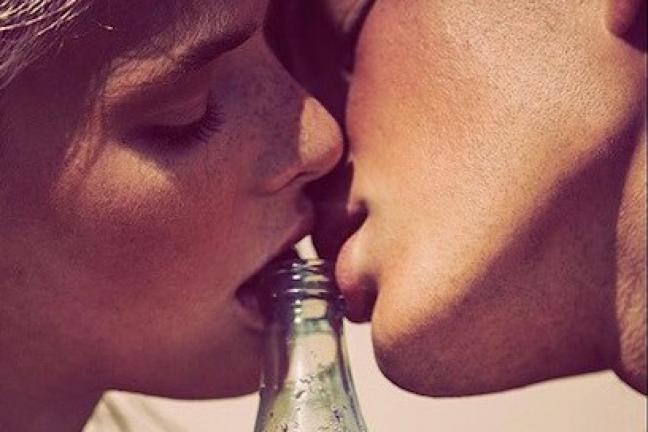 Same-sex couples kissing in a Coca-Cola campaign